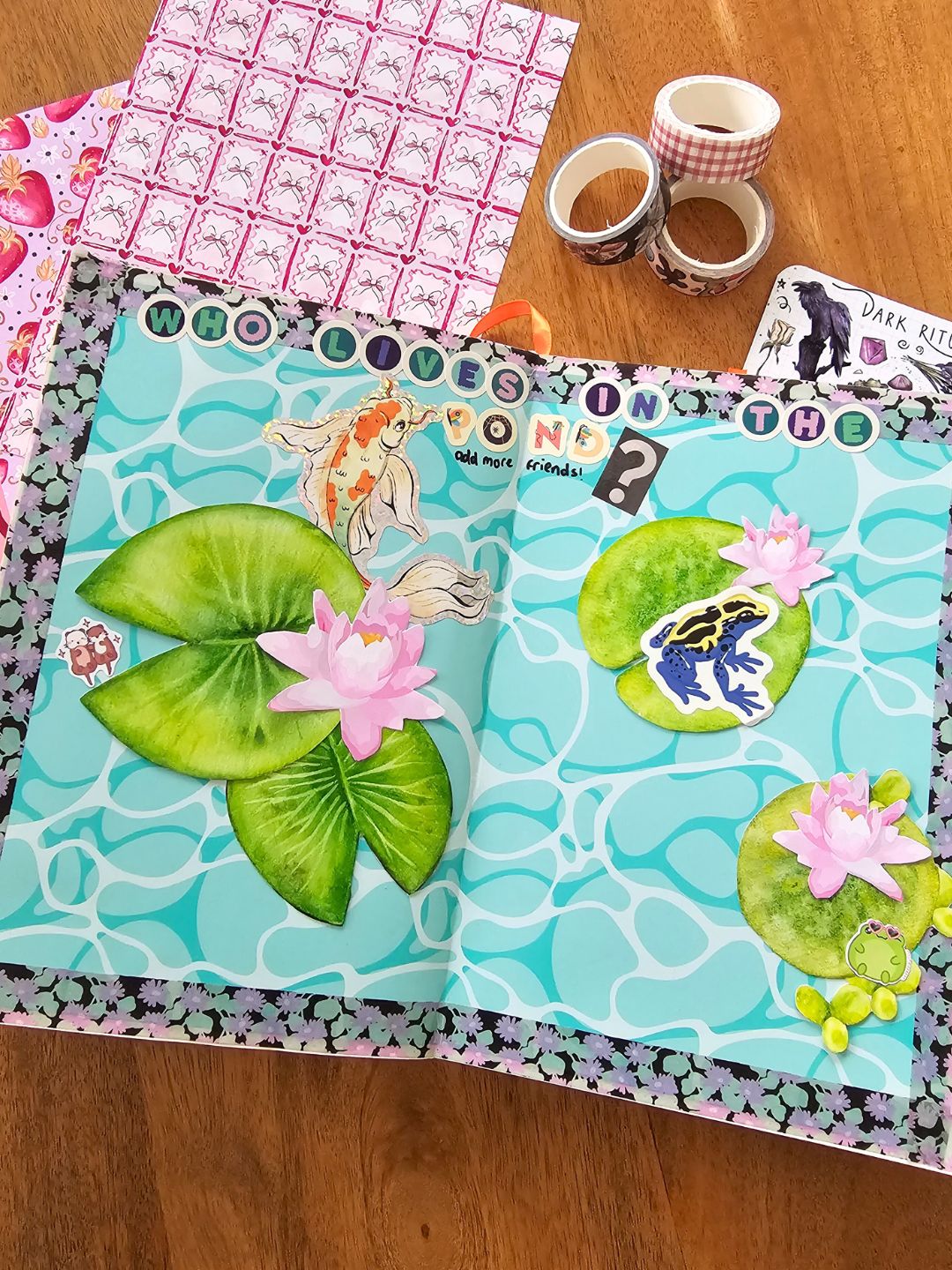 a creative journal page showing a fish pond with lilypads and the text: who lives in the pond? 