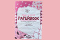 Pink 'n Cute Paperbook with decorative design on a pink background