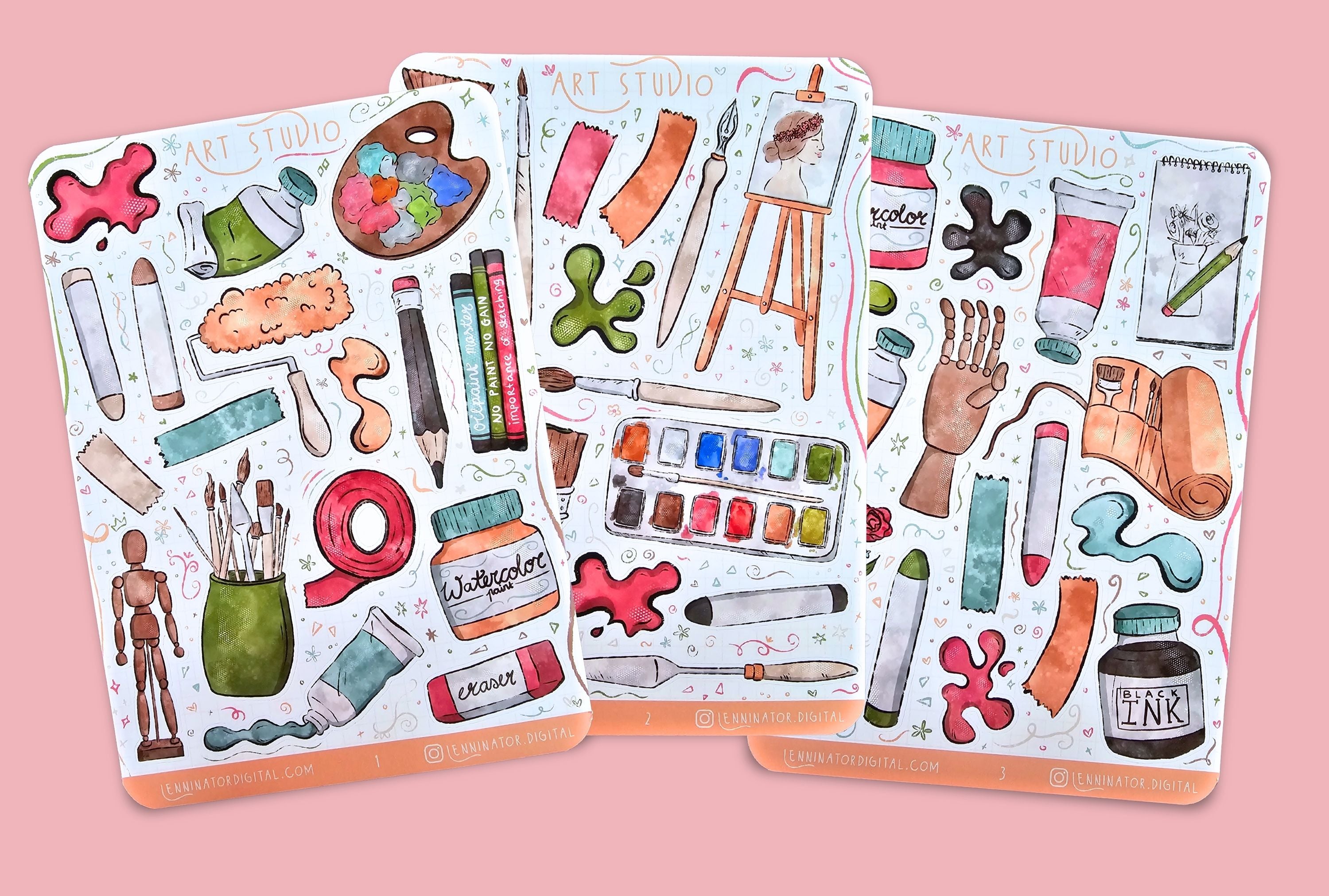 Set of art-themed stickers on a textured surface