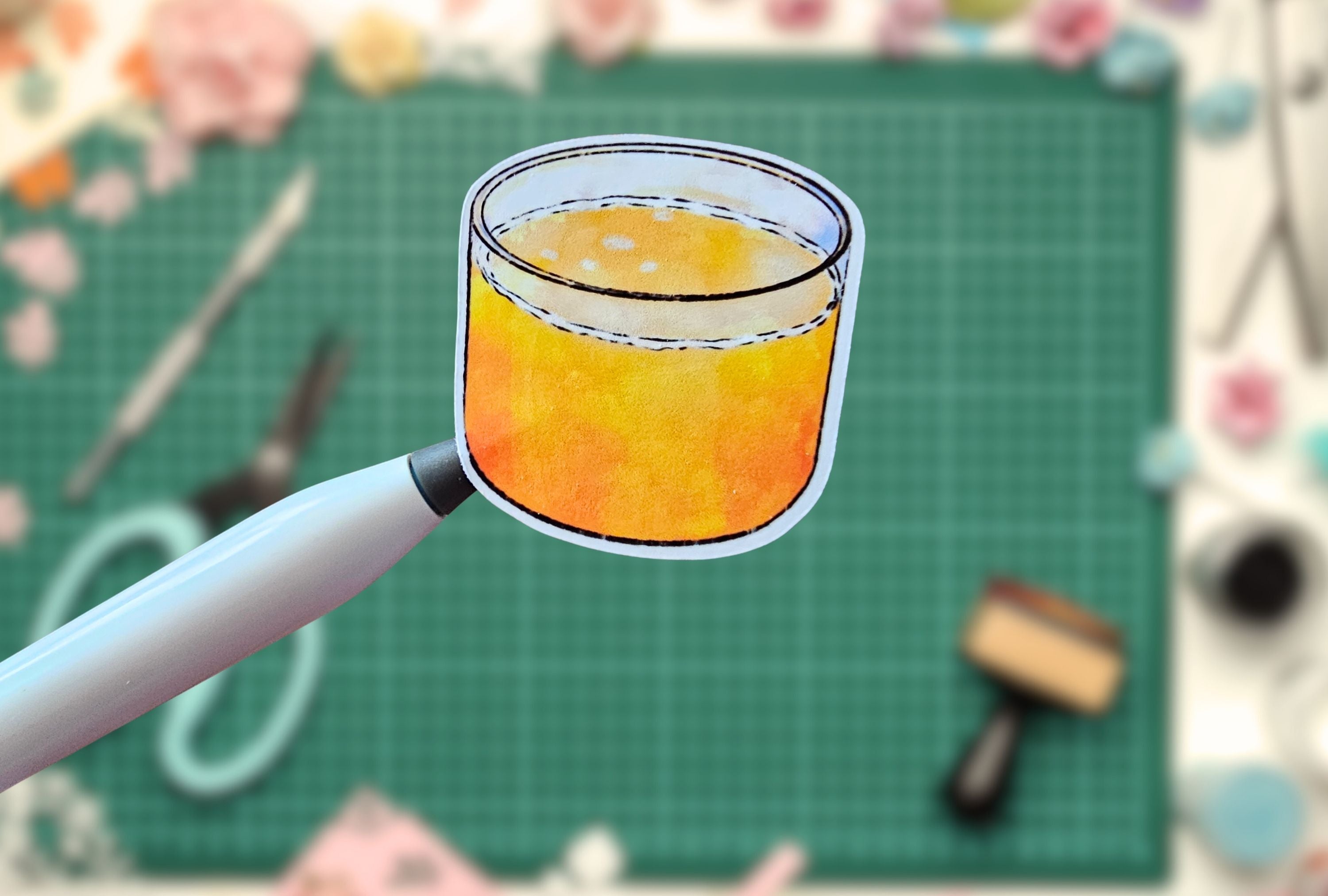 Stylized illustration of a glass with orange juice on a craft table.