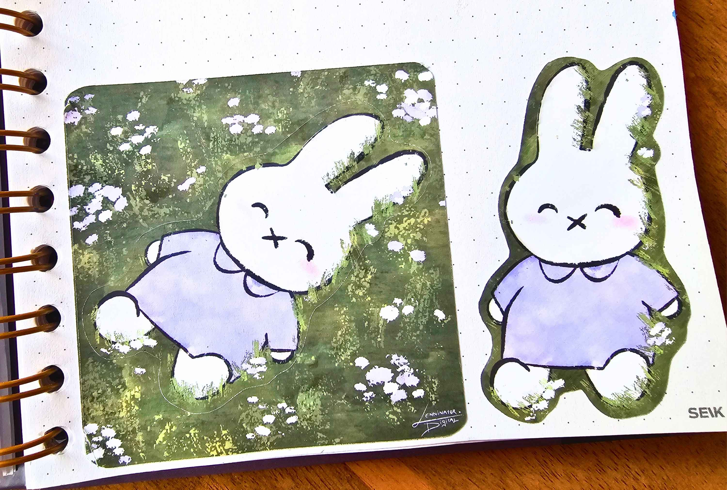 A close-up of a spiral-bound notebook page showing two illustrated bunny drawings. The left drawing is inside a square printed panel with a textured green and white floral background, and the right drawing is an outlined sticker or cutout on the white page.