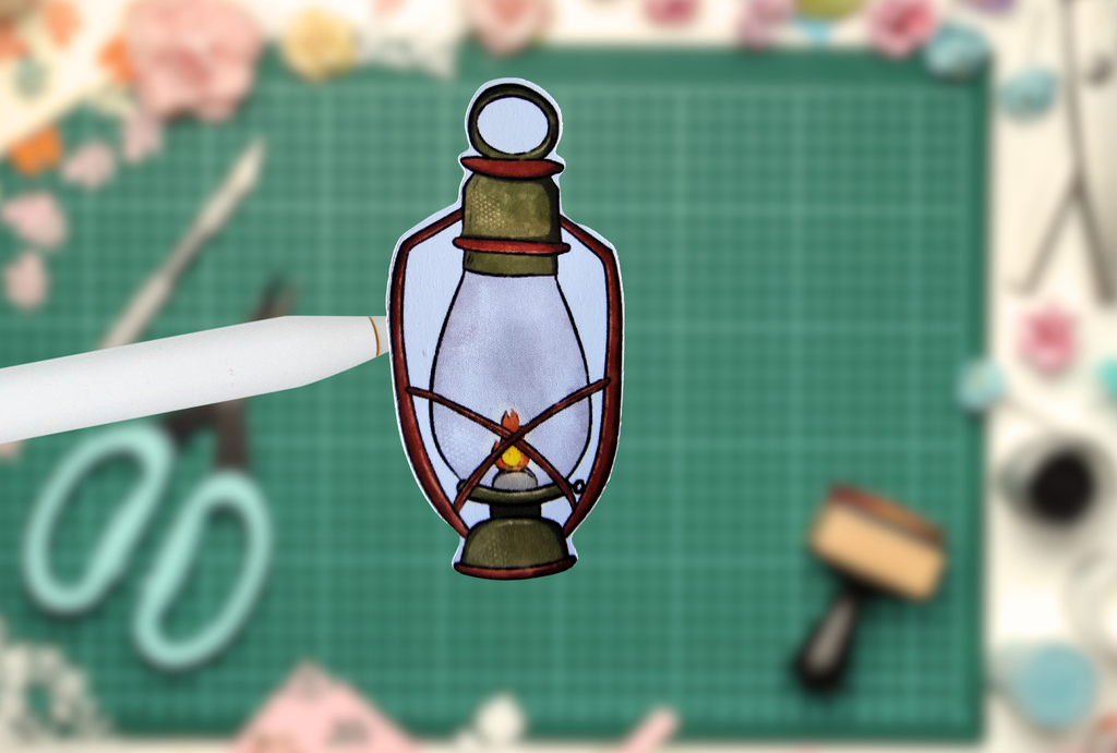 Decorative paper lantern on a pen with a craft background