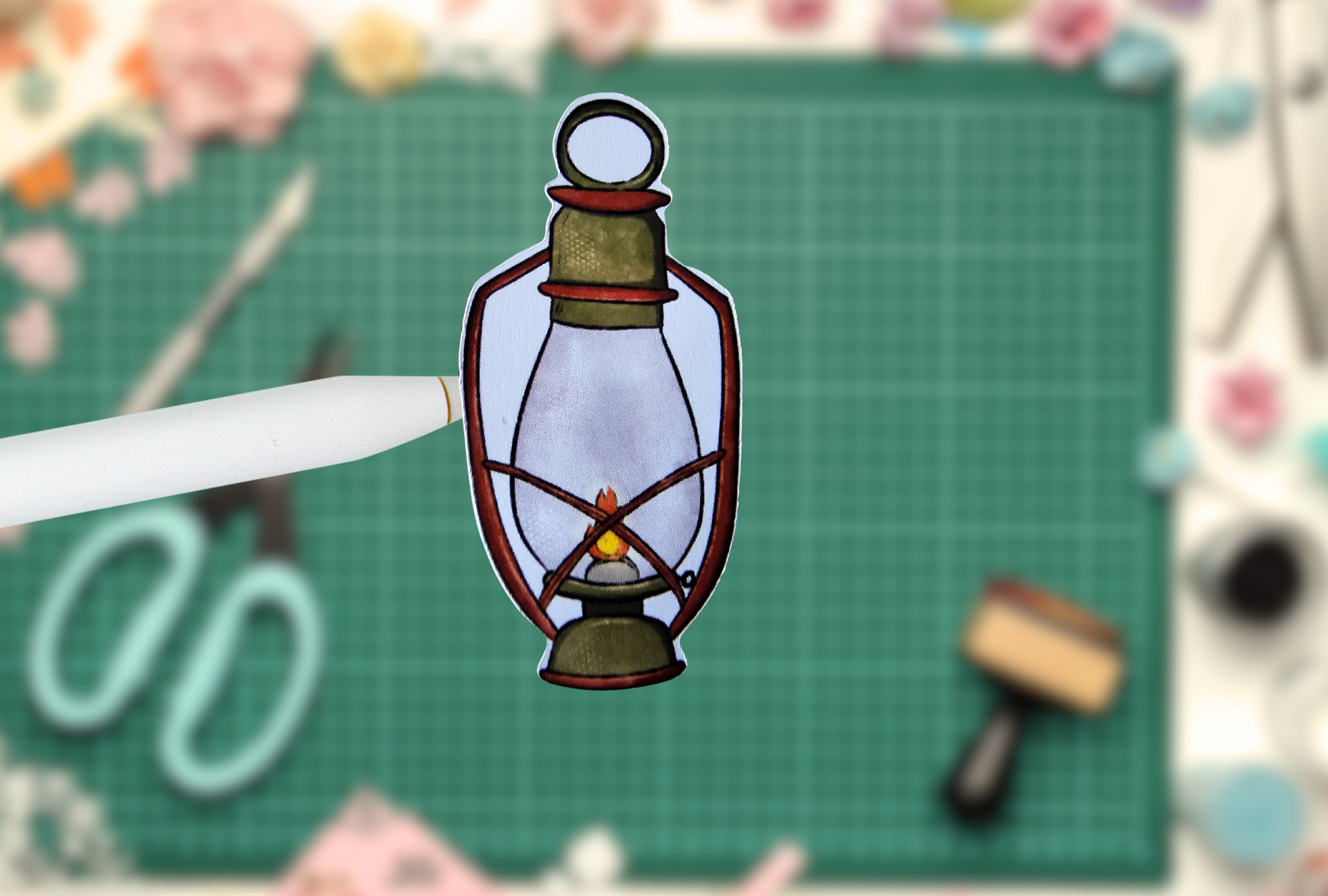Decorative paper lantern on a pen with a craft background
