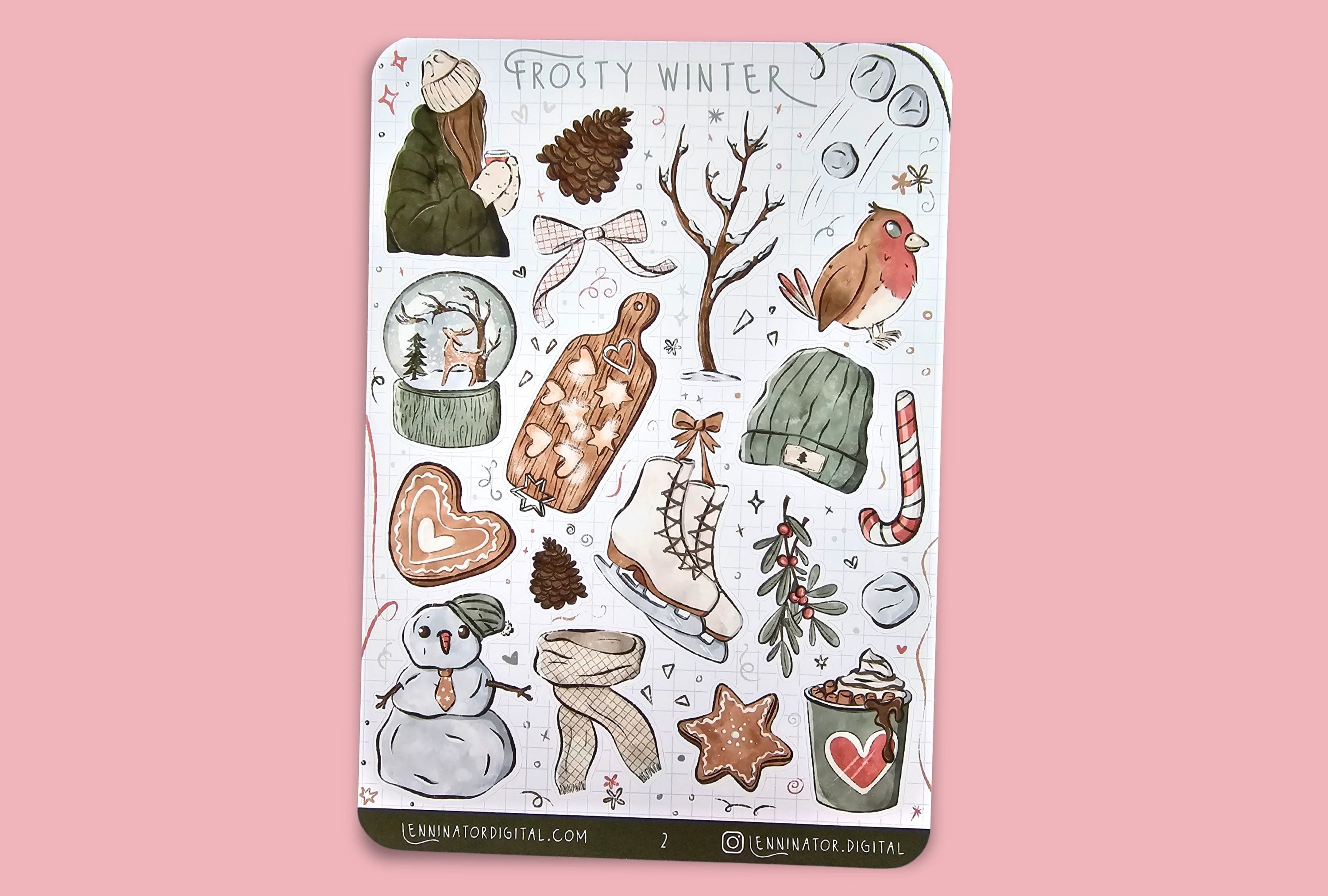 Sticker sheet with winter-themed illustrations on a brown background with cookies and hot chocolate.