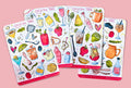Four sheets of cocktail-themed stickers on a textured surface in bright colors. 