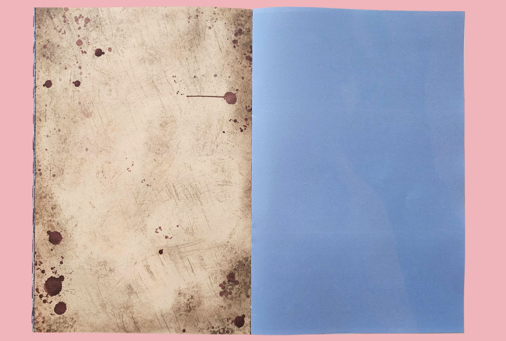 Two textured paper sheets, one brown with red blood spots and one blue, on a pink background.