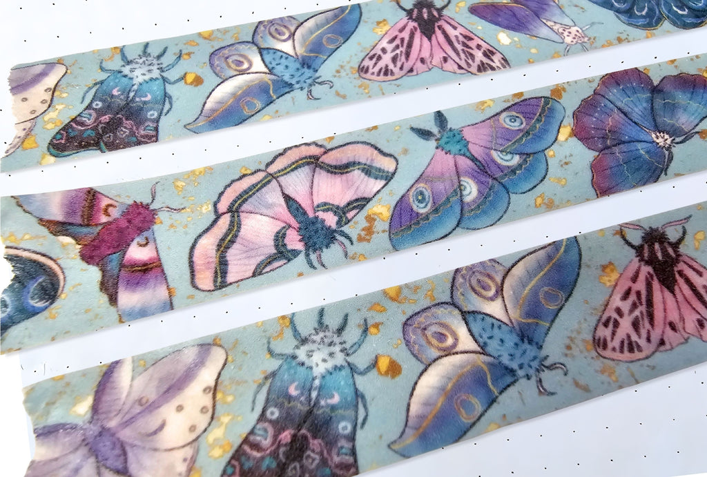 Cose-up of galaxy moth washi tape on white paper