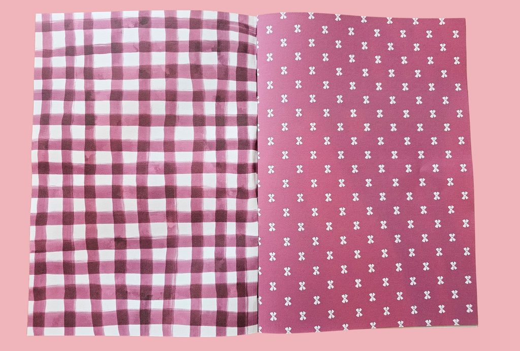 Two paper pages with checkered gingham and ribbon patterned designs on a pink background
