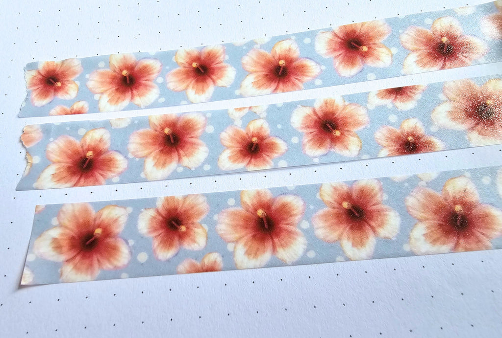 Three strips of floral-patterned washi tape paper on a white background