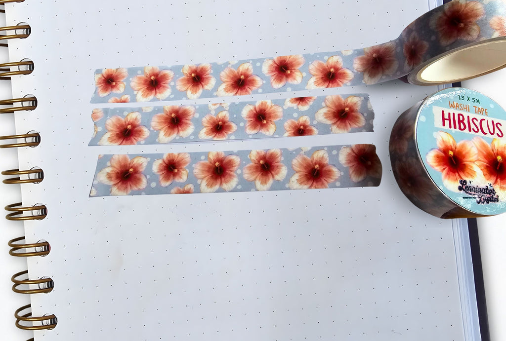 Floral washi tape with a visible brand name on a notebook page