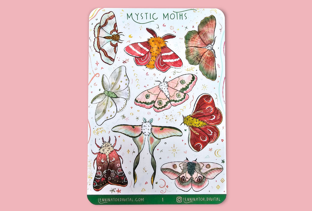 Sheet of 'Mystic Moths' stickers on a wooden surface with flowers.
