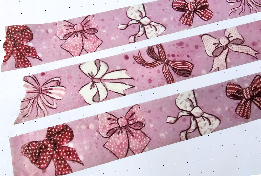 Pink Ribbon washi tape close-up on a paper sheet