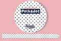 A roll of white washi tape with navy blue polka dots, labeled 'Polkadot' and 'Keminator Kabinet', shown against a solid pink background with a strip of the tape unrolled below.
