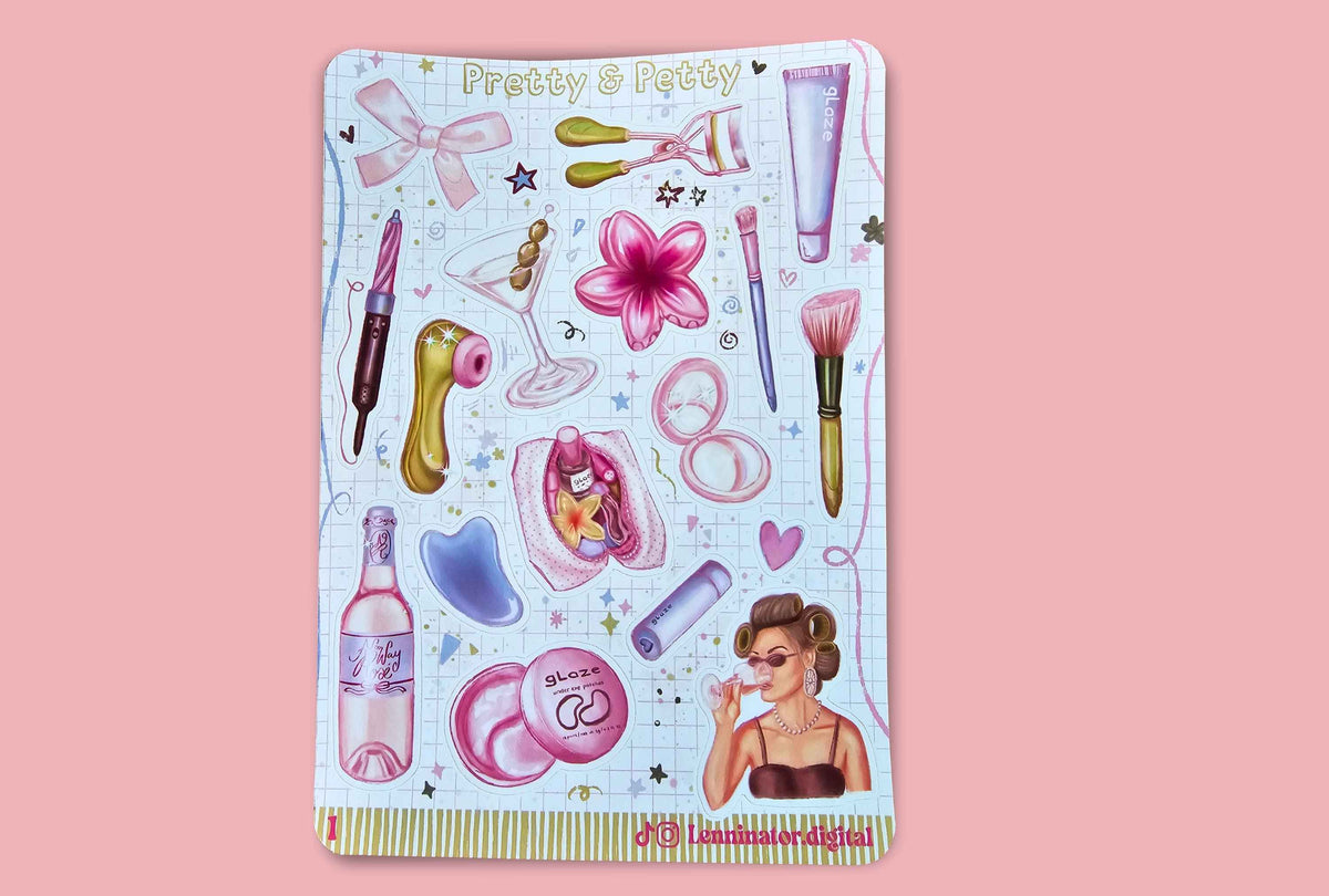 A decorative sticker sheet featuring retro cosmetics and beauty-themed illustrations, including makeup brushes, compacts, a pink flower, a bottle, and a woman with sunglasses, on a light blue grid background. The sheet is displayed against a solid pink backdrop.