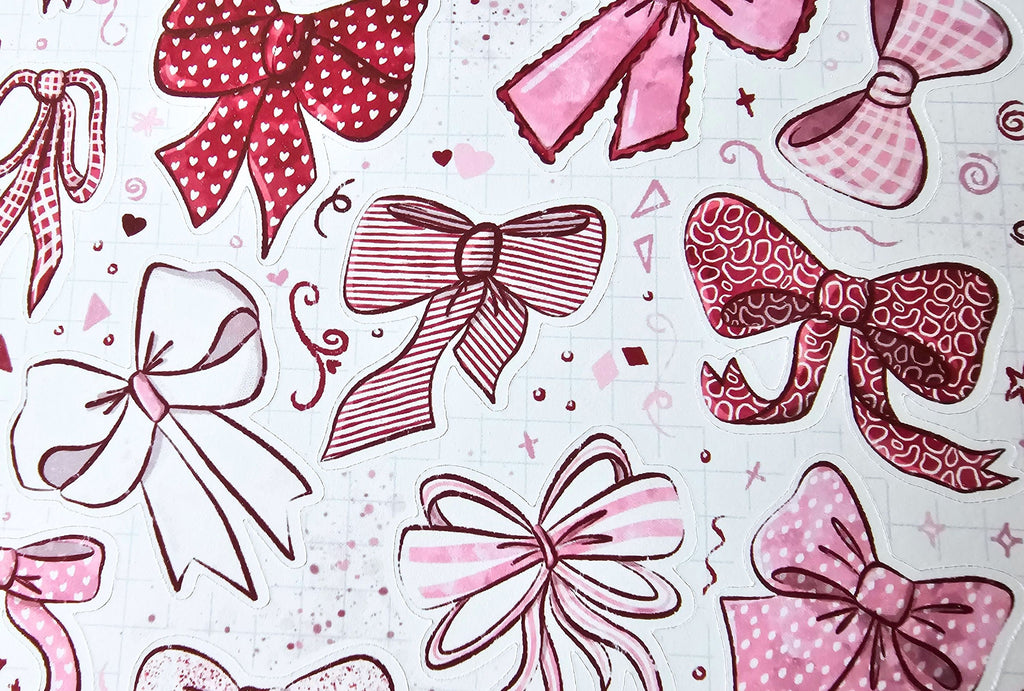 variously designed bows in pink and red on a light background