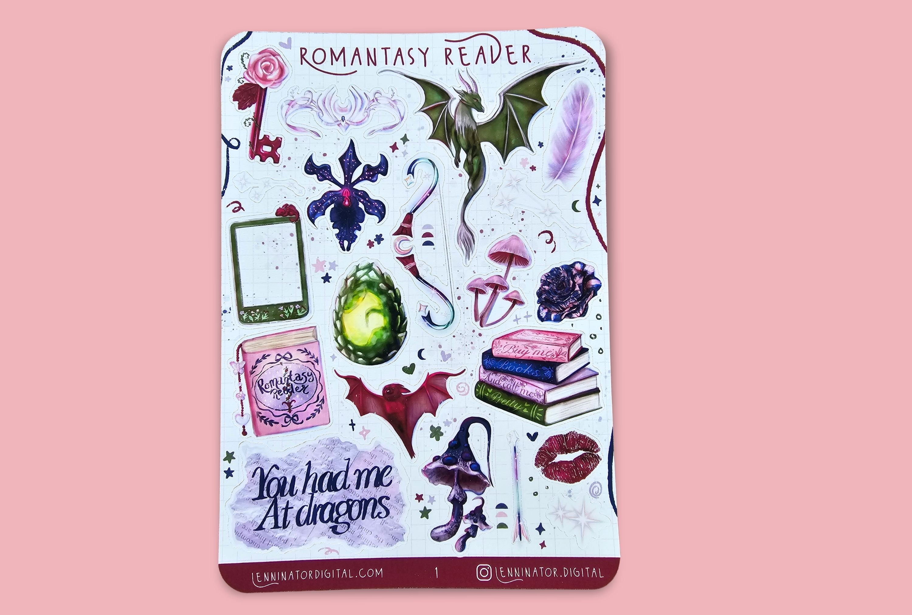 A vertical sticker sheet titled 'Romantasy Reader' featuring various watercolor illustrations of fantasy-themed elements like dragons, a green egg, books, a key, and lips, displayed against a solid pink background.