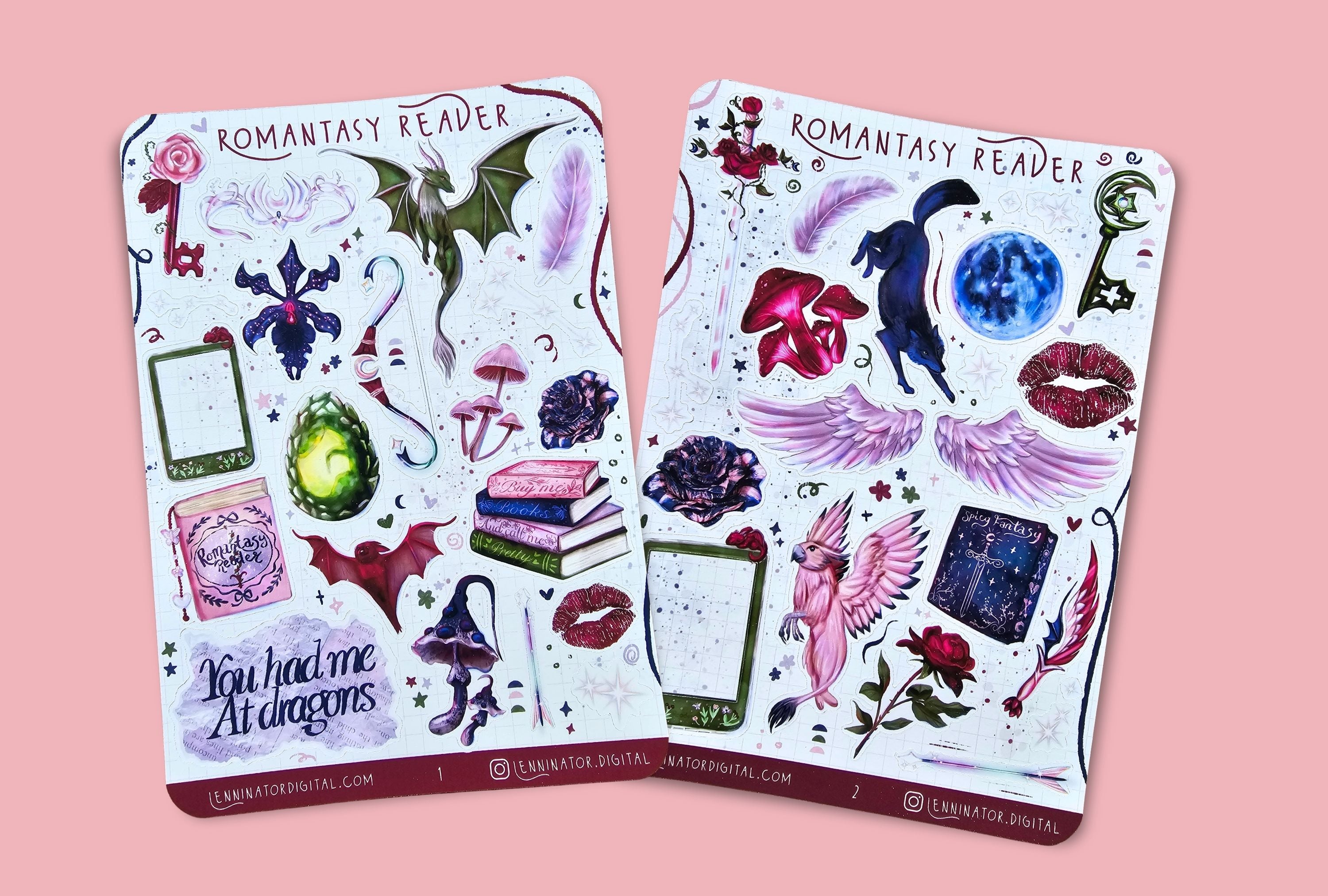 Two decorative planner stickers featuring whimsical fantasy illustrations, displayed on a solid pink background. The designs include dragons, roses, wings, a key, a moon, and books, with the text 'ROMANTASY READER' at the top of each card.
