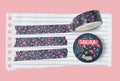 Japanese Cherry blossom washi tape with pink flowers on a blue background.