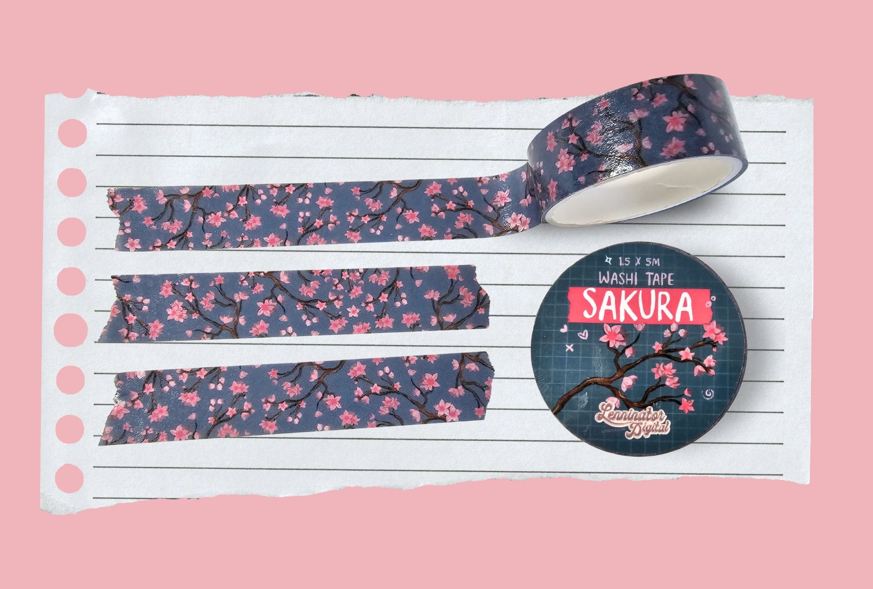 Japanese Cherry blossom washi tape with pink flowers on a blue background.