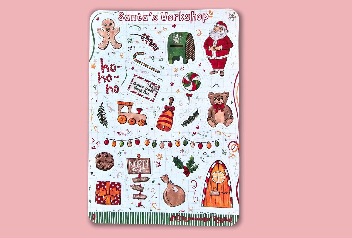 A rectangular sticker sheet titled 'Santa's Workshop' featuring various Christmas-themed illustrations like Santa Claus, a gingerbread man, a teddy bear, a train, candy canes, and holiday decorations, displayed on a solid pink background.