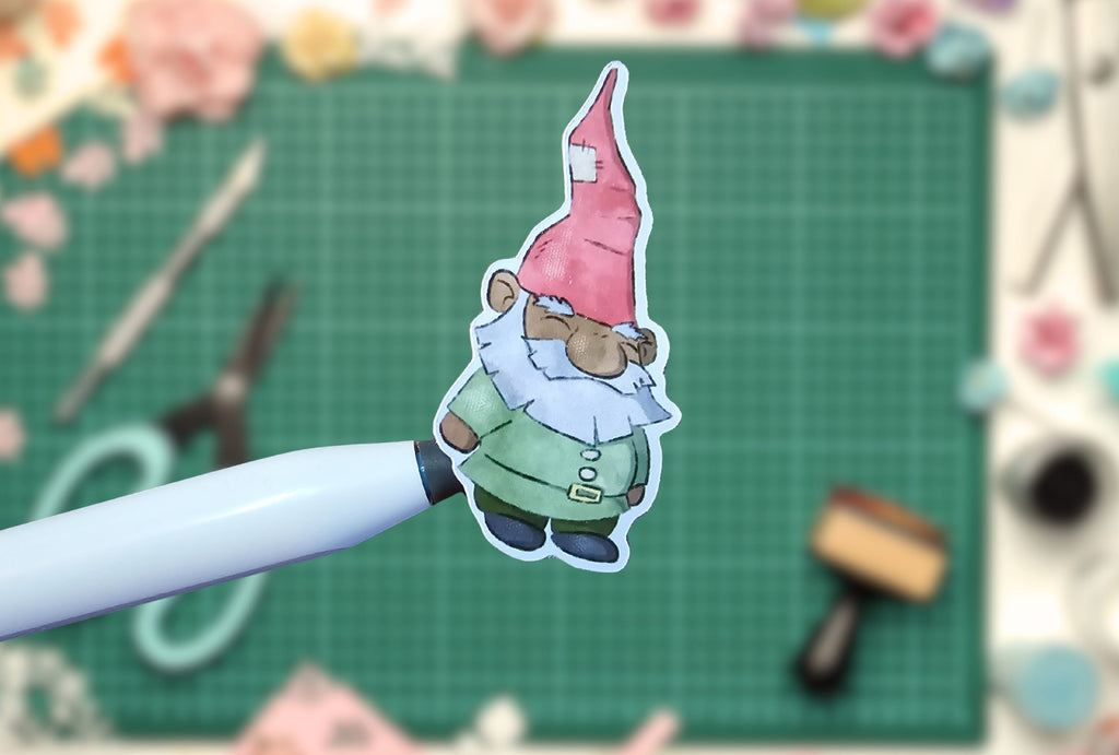 Gnome sticker on a pen with a crafting background
