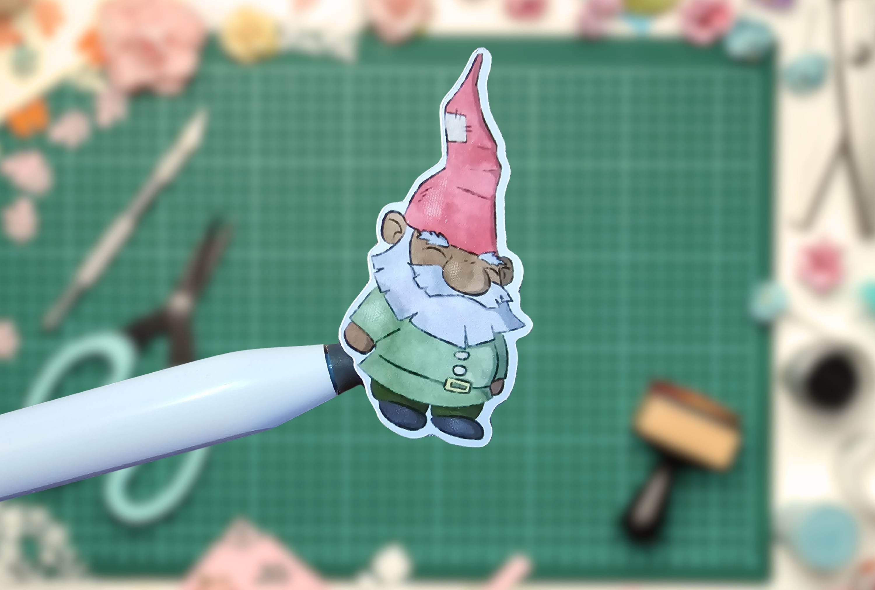Gnome sticker on a pen with a crafting background