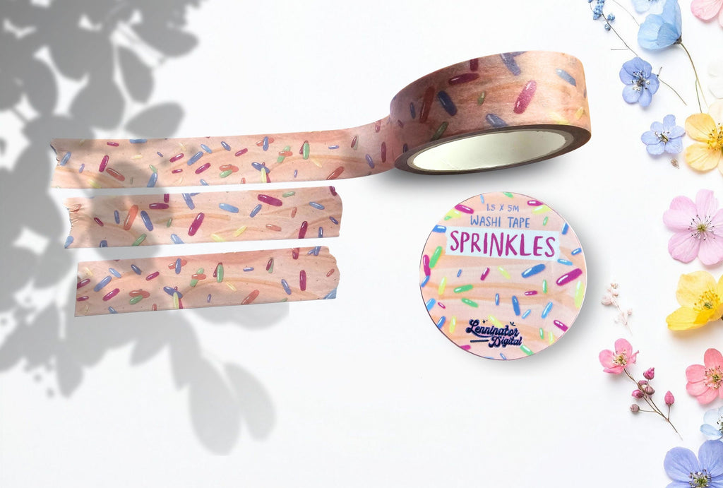 Decorative washi tape with sprinkles design on a white background with flowers.
