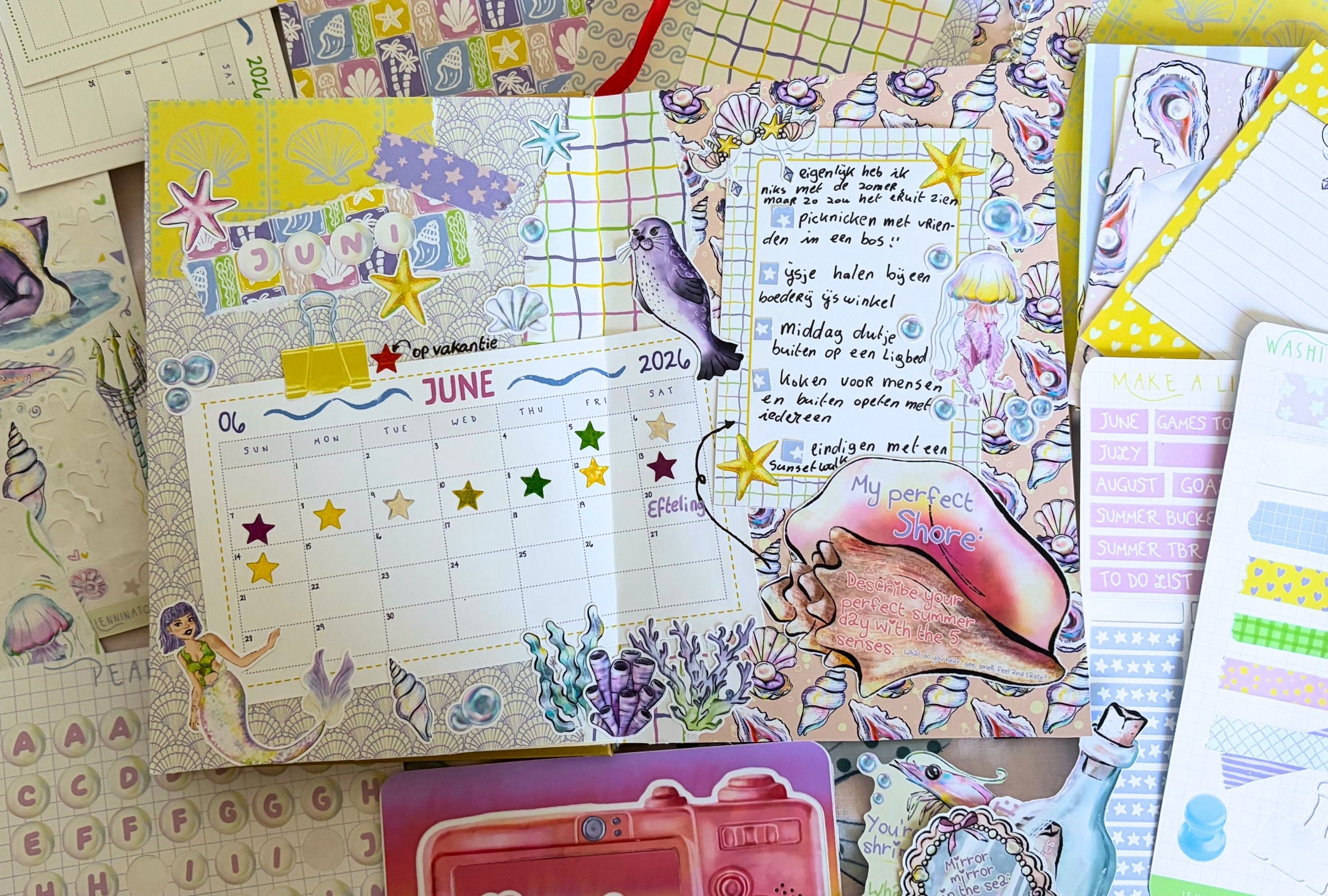 Colorful planner with various designs and text on a textured surface