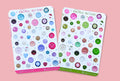 Two sheets of 'Vintage Buttons' stickers on a pink background