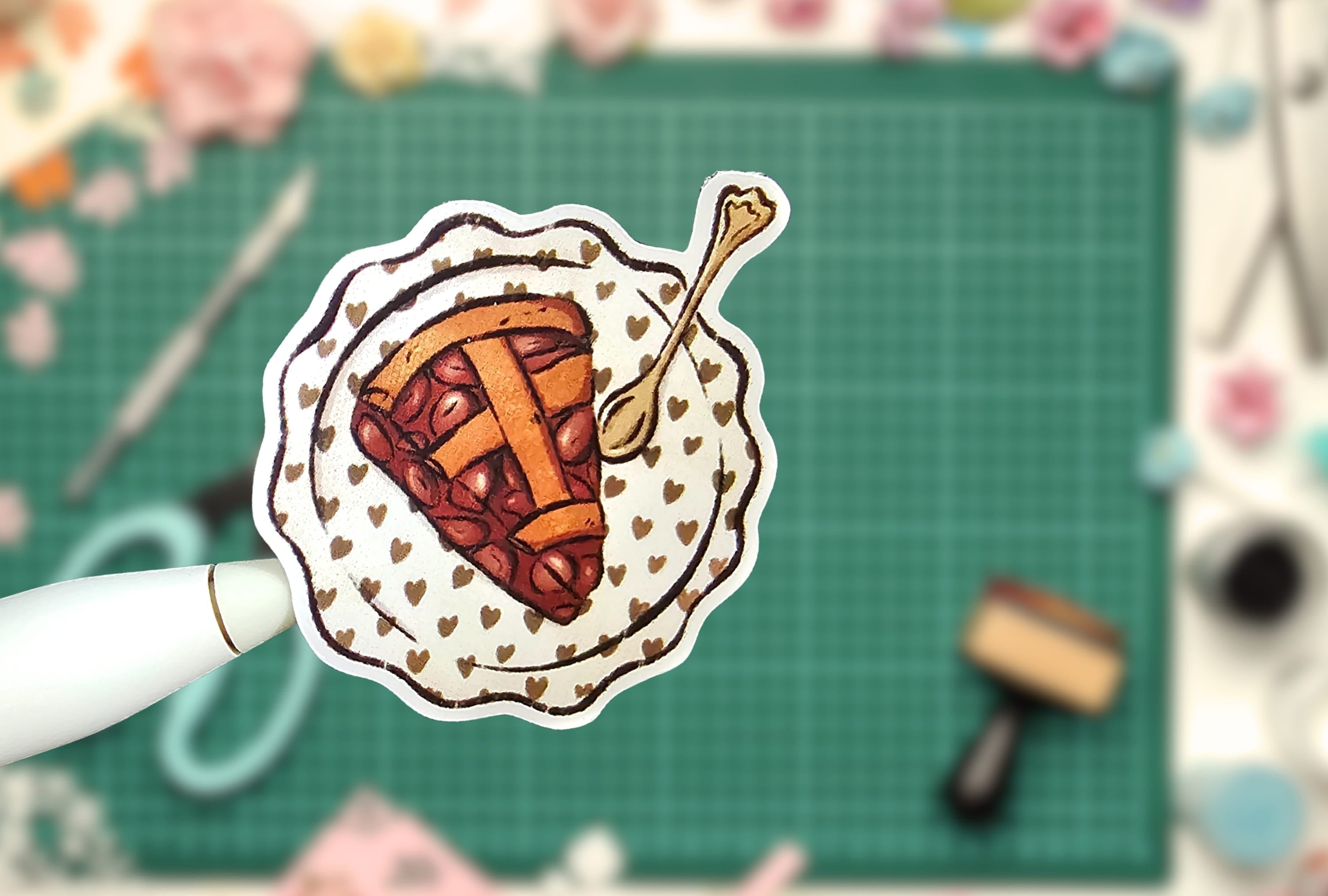 Sticker of a pie with a spoon on a grid background