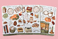 Vintage Autumn-themed sticker sheet with illustrations on a textured surface. Illustrations of books, cat, warm drinks, comfort food, mushrooms, leafs, animals, candles and vintage stuff