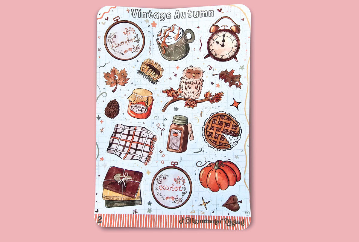 A sheet of planner stickers with a 'Vintage Autumn' theme, featuring illustrations of pumpkins, pies, an owl, a mug, and autumn elements on a white background with an orange striped border, set against a solid pink backdrop.