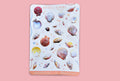 A sticker sheet with real sea shells in pink, yellow and orange tones