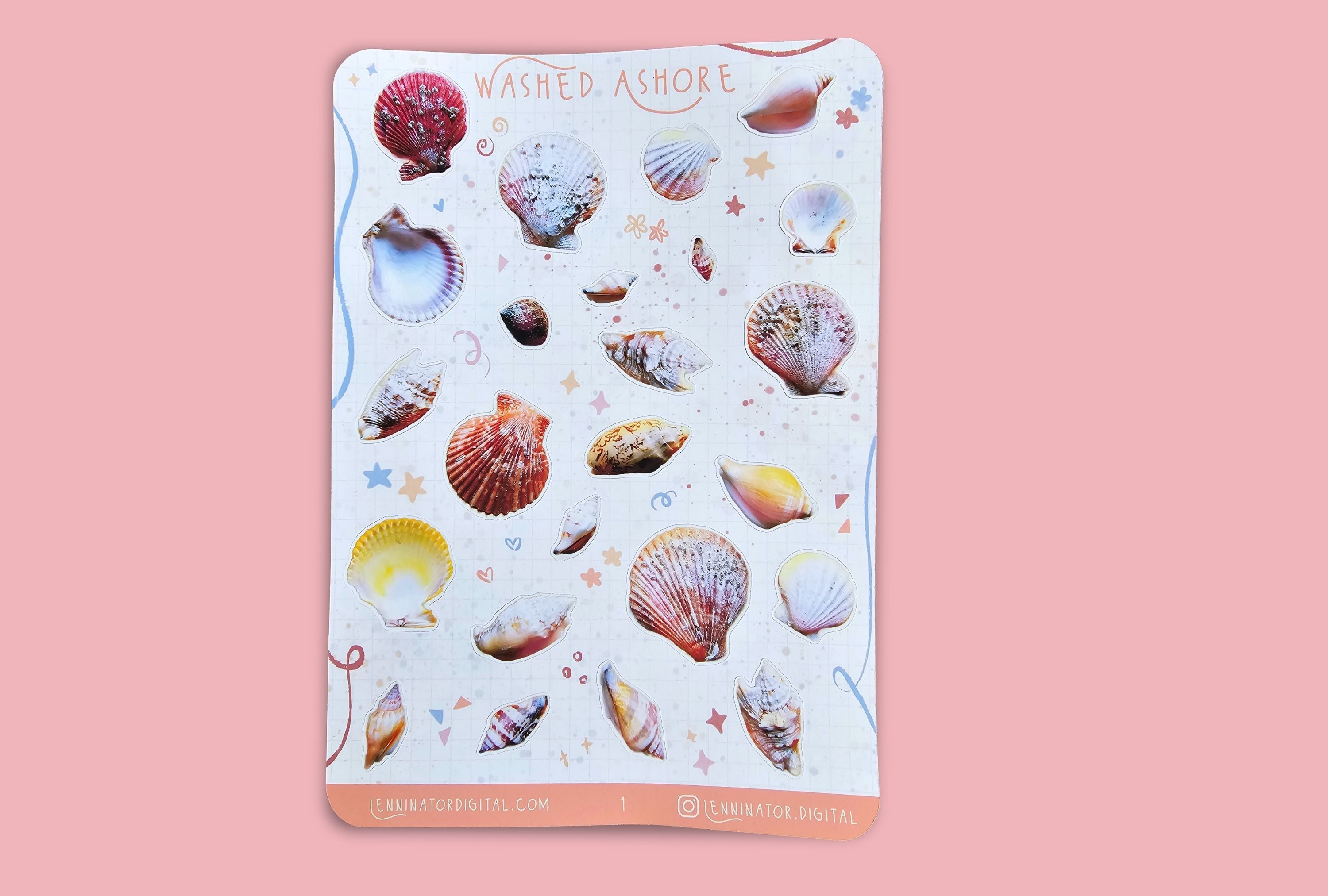 A sticker sheet with real sea shells in pink, yellow and orange tones