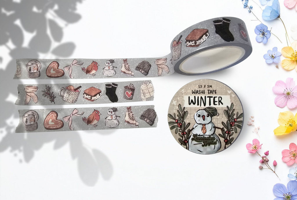 Washi tape with winter themed illustrations like snow globe, scarf, cookie, robin, ribbon, snowman, ice skates, hat, jacket, warm chocolate drink and smores