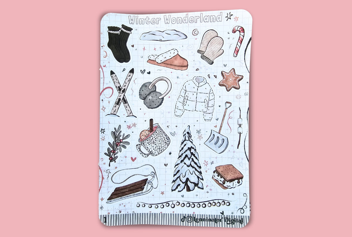 A rectangular sticker sheet featuring hand-drawn winter illustrations such as socks, a hat, mittens, candy cane, skis, snow boots, jacket, star, shovel, s'mores, and a Christmas tree on a white background, set against a solid pink backdrop.