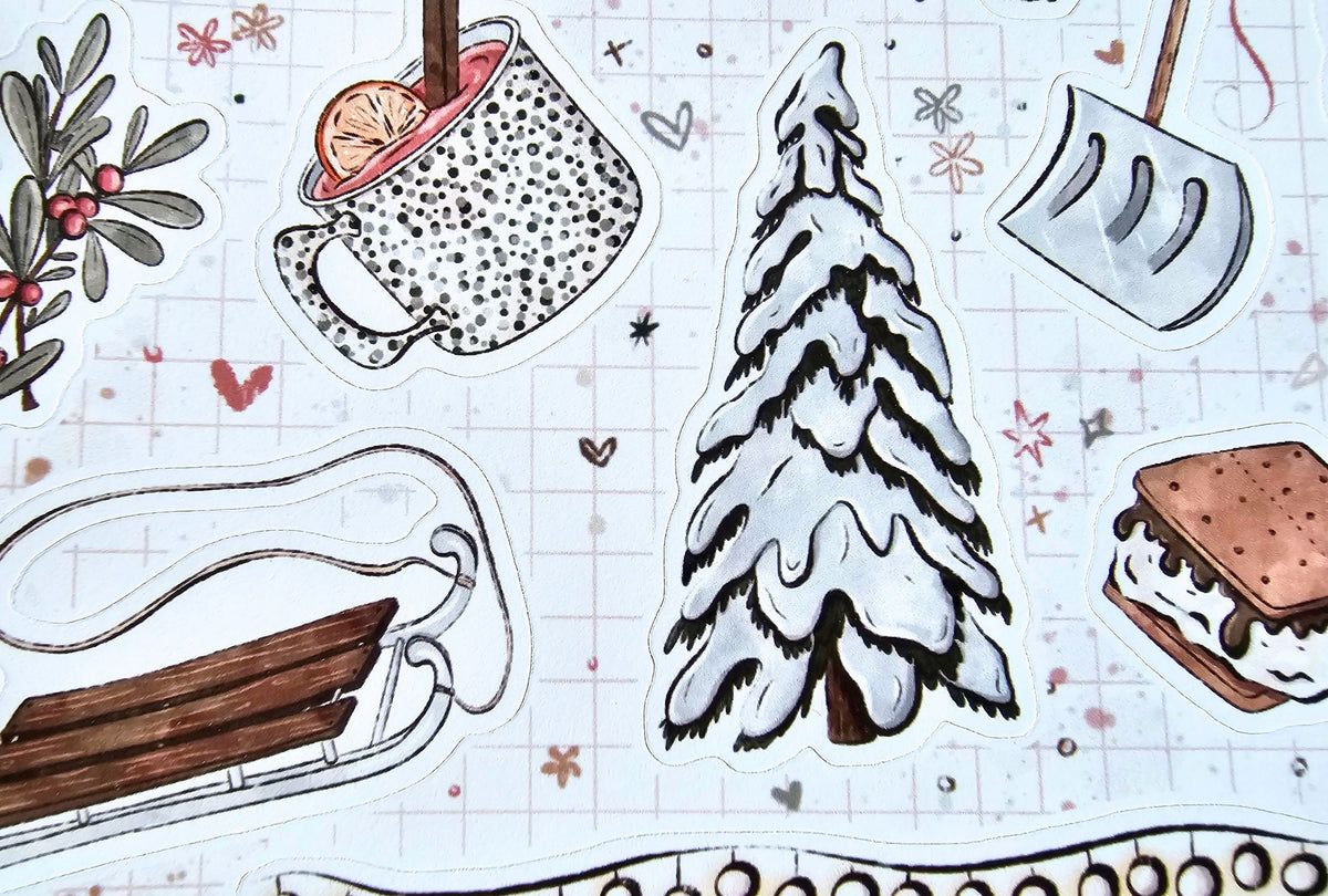 A collection of hand-drawn winter-themed stickers on a white grid paper background, featuring a snow-covered pine tree, a mug of hot cocoa with an orange slice, a snowboard, a s'mores sandwich, and a snow shovel.